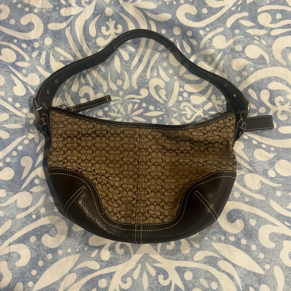 Coach Hobo bag, brown signature print with leather strap and trim.